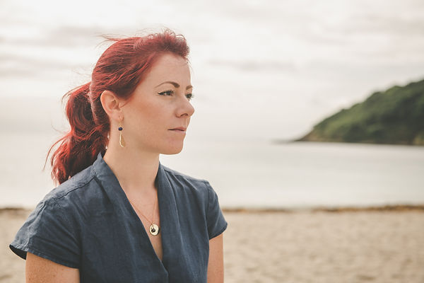 Geometric minimal jewellery designs made in Cornwall.  Hammered Brass and Lapis Lazuli earrings.  Hand made pendant necklace